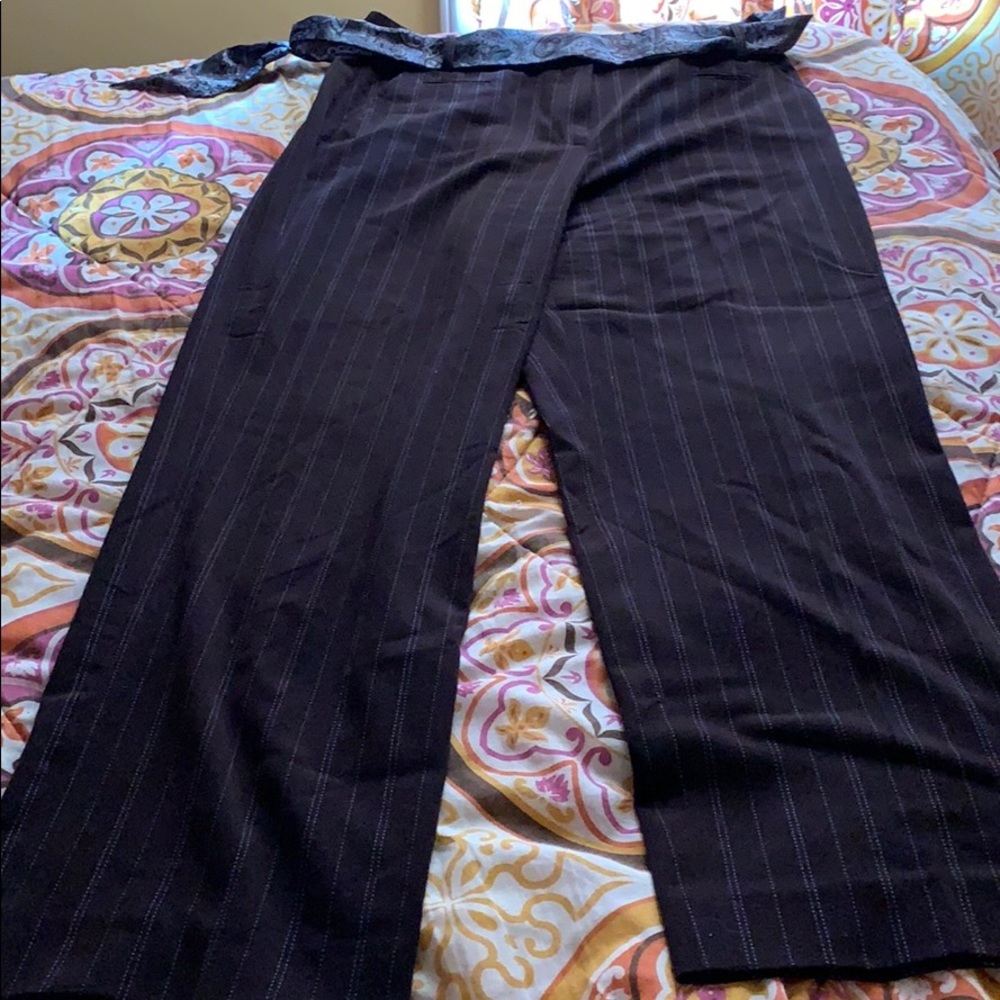Brown pants with a silky cloth as the belt
